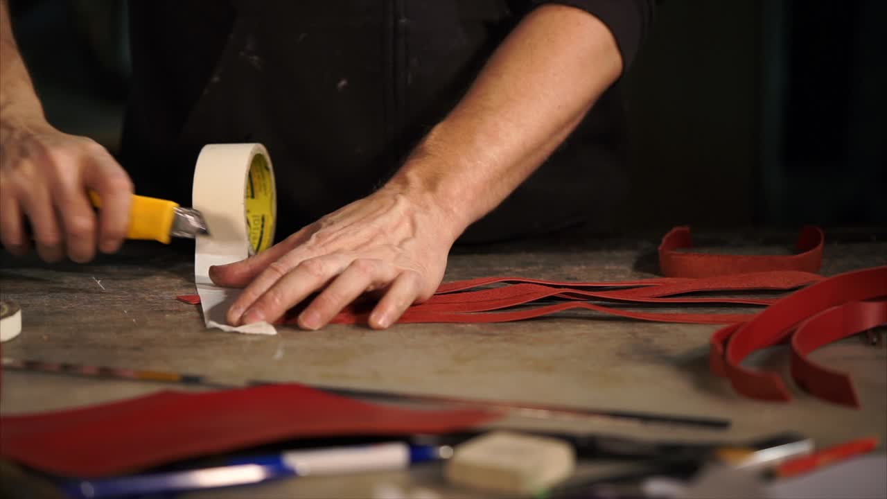 Leatherworker Crafting Red Leather Strips