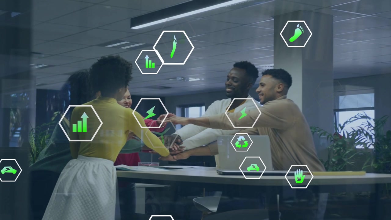 Woman in yellow initiating hand-stack, team aligning on energy plan with floating green hex icons