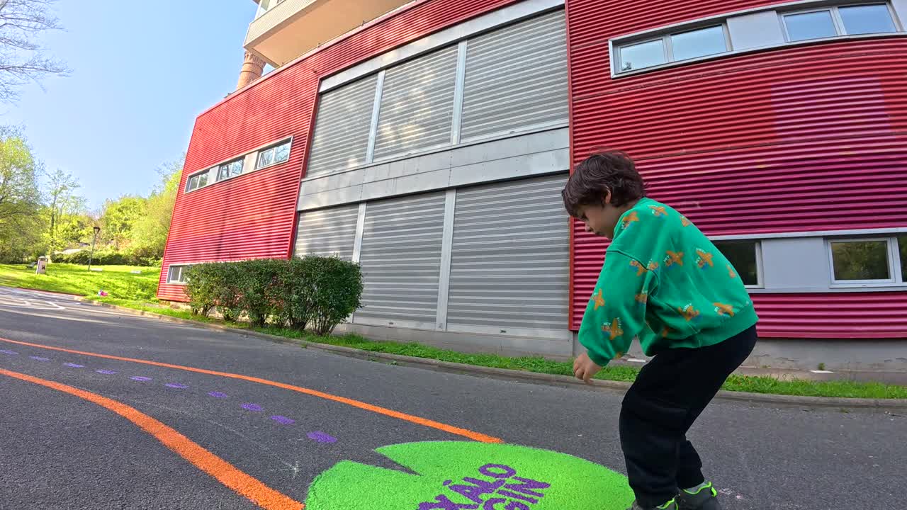 Child Playing Hopscotch Outdoors