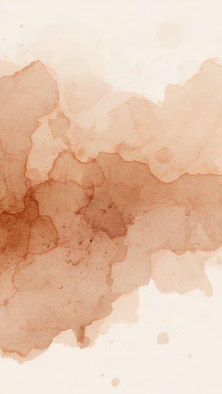 Vertical video: Starting with first frame, close-up cream paper showing warm brown wash, droplets