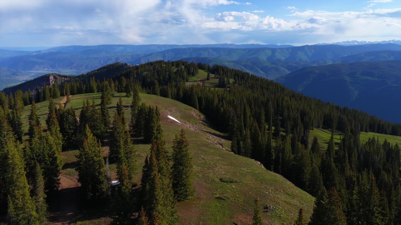 Spring summertime morning Little Annie Basin Trailhead AJAX top of Aspen Mountain aerial drone Independence Pass snow covered Rocky Mountains sunny blue sky Silver Bell Trailhead Richmond Hill forward