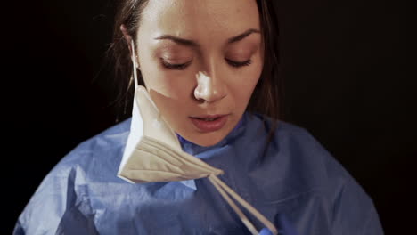 female doctor in uniform standing in hospital