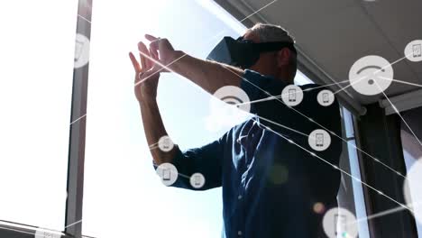 Animation-of-networks-of-connections-and-businessman-wearing-phone-vr-headset