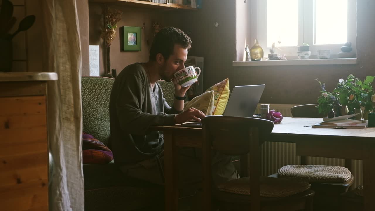 Working at home on a laptop with a cozy and peaceful setting, natural light