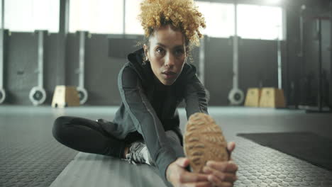 woman stretching in a gym