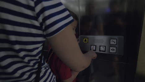 family using lift at subway station