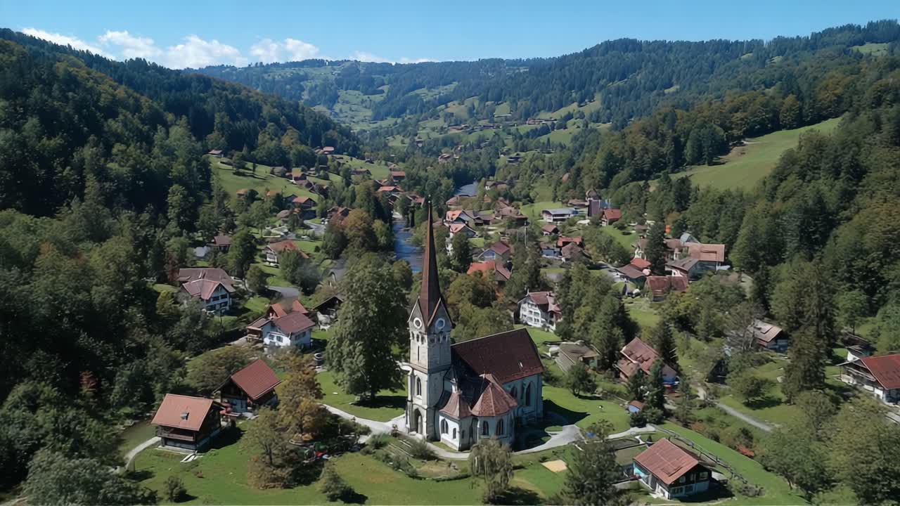 Aerial View of Serene Village Surrounded by Lush Mountains and Scenic Landscapes Featuring a Historic Church and Quaint Homes