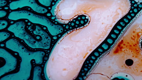 Liquid mixing in a colorful macro shot showing vibrant fluid dynamics and bubbles