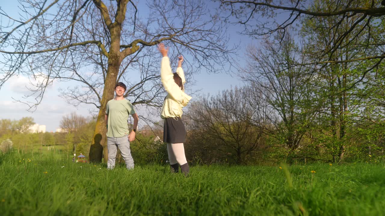 Young Adults Dancing in a Park
