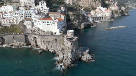 Epic-drone-footage-of-small-fort-on-Amalfi-coast,-Italy