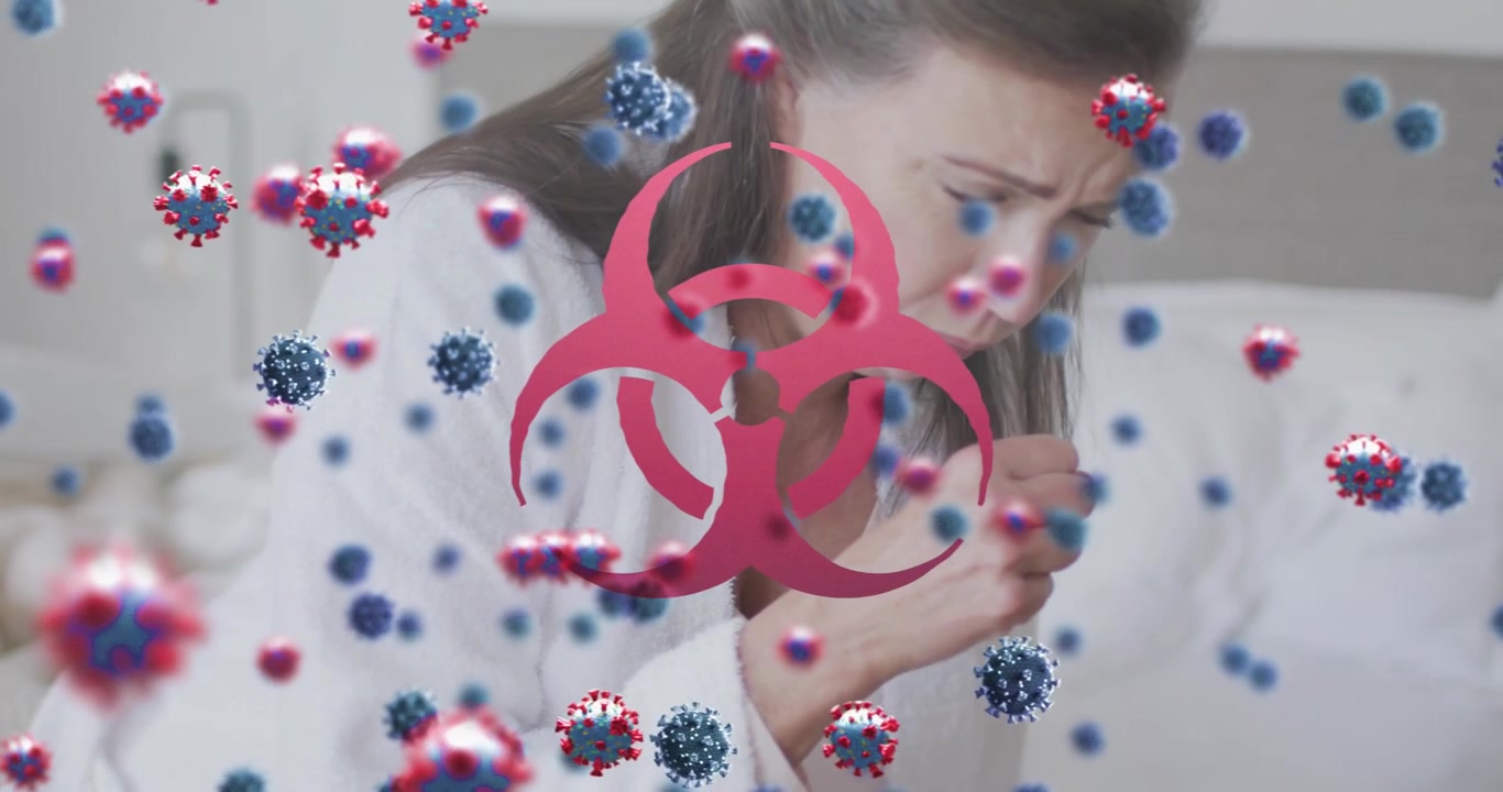 Animation of virus cells and biohazard symbol over caucasian woman