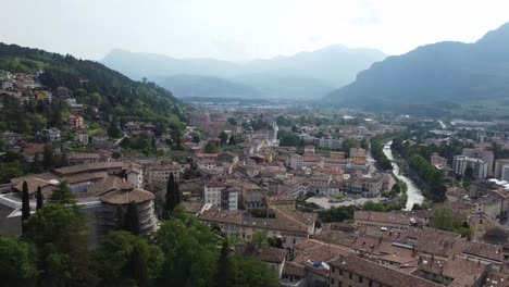 beautiful italian city of rovereto in mountain valley, aerial drone view