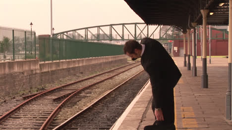 man waiting for train