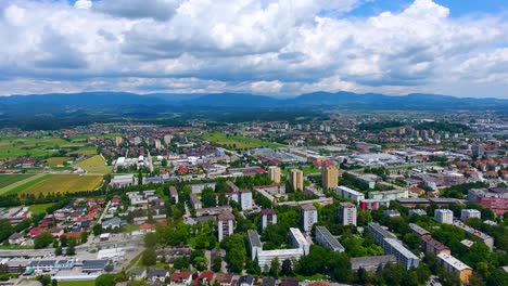 Aerial-View-Above-Green-Town-of-Celje-Slovenia-Blue-Sky-above-Mountains-in-Clean-Neighborhood-in-East-European-Summer-Weather