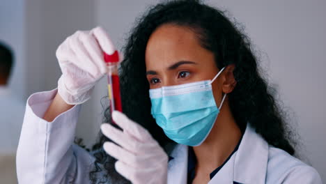 Face-mask,-blood-test-and-scientist-in-laboratory