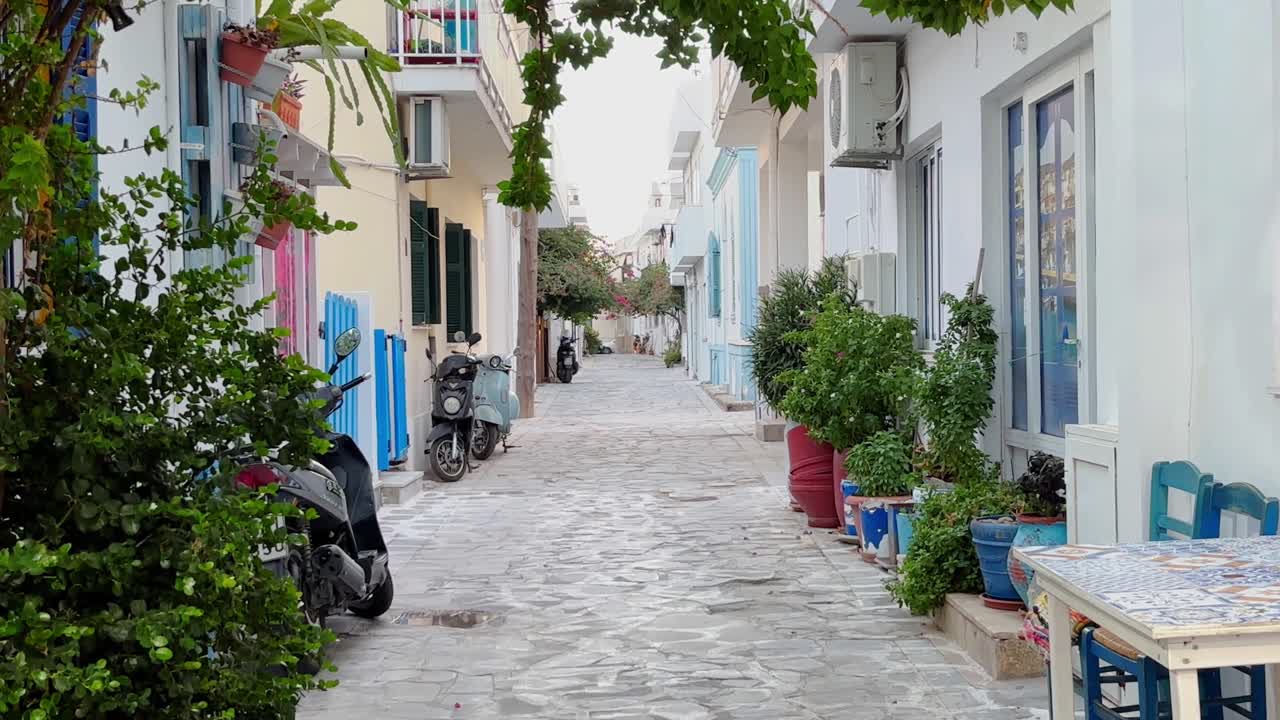 A quiet alley in Kardamena, Kos, Greece, with charming houses and lush greenery
