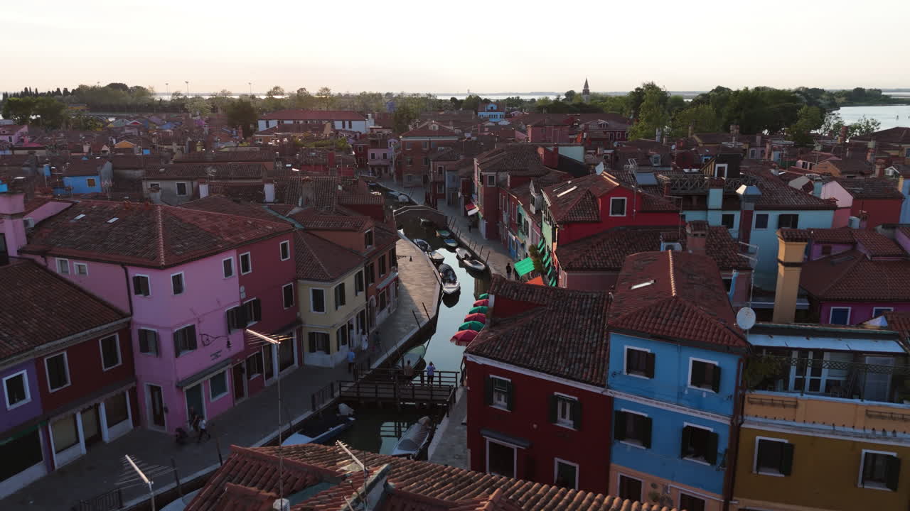 Colorful Houses Over Canal With Boats, Burano Island In Venice, Italy - Aerial Drone Shot