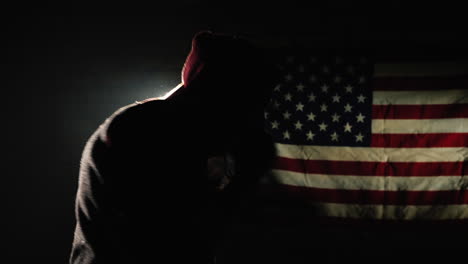 Fighter-trains-against-backdrop-of-American-flag