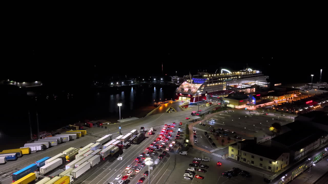 Hyperlapse drone shot of cars moving inside the ferry, night at the Port of Turku