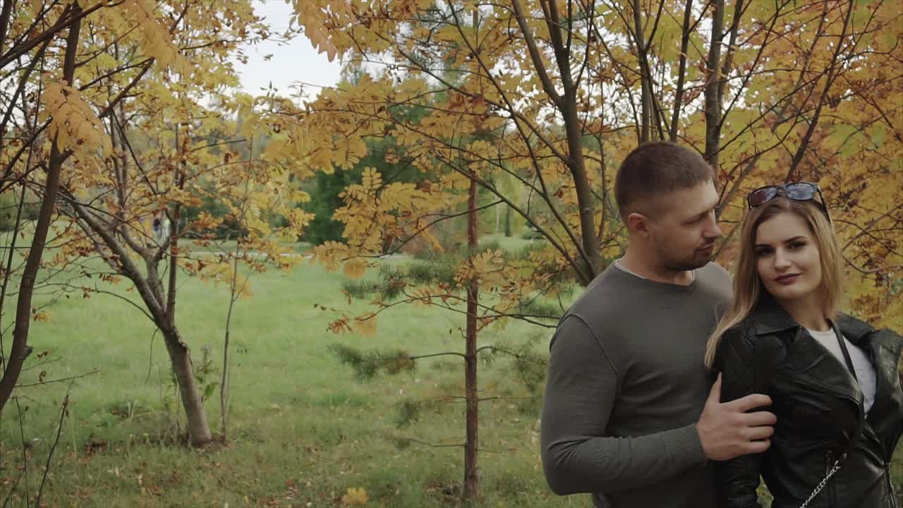 Couple enjoying a walk in autumn park