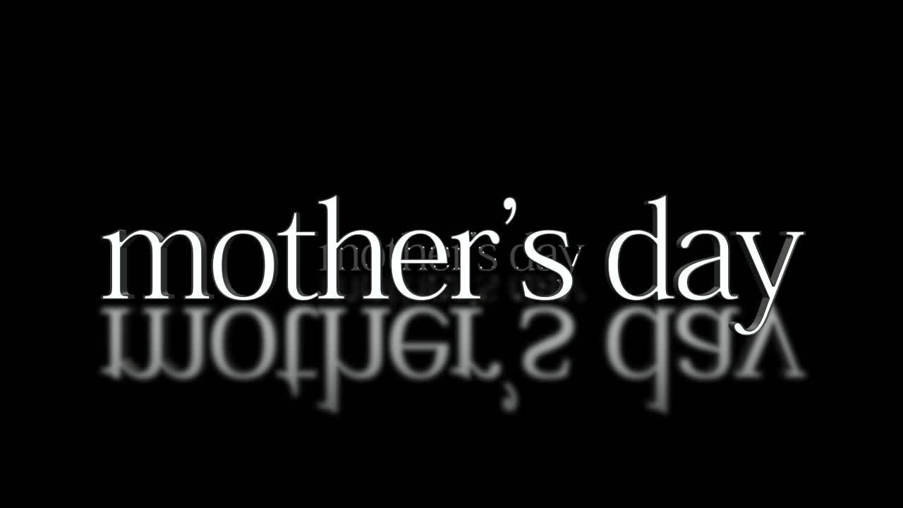 Celebrating Mothers Day reflections of love in white letters on black background