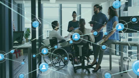 animation of network of connections with icons over disabled and diverse colleagues at meeting