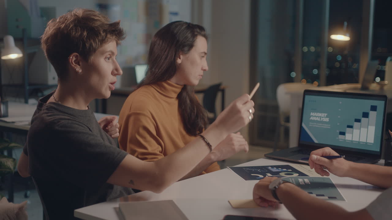 Business Team Working on Project in Office at Night