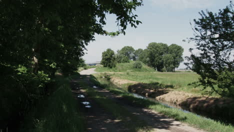 Northern-Italy-countryside,-dirt-road-in-the-shade-BBMC-25P-APPPLE-ProRes