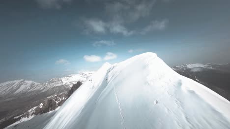 FPV-drone-flying-low-following-the-peak-of