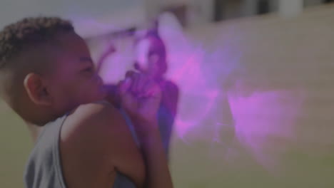children playing with colorful animation light effects in school playground
