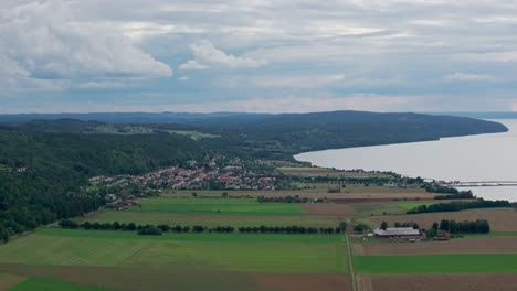 swedish village and farm fields seen from brahehus castle near vattern, sweden