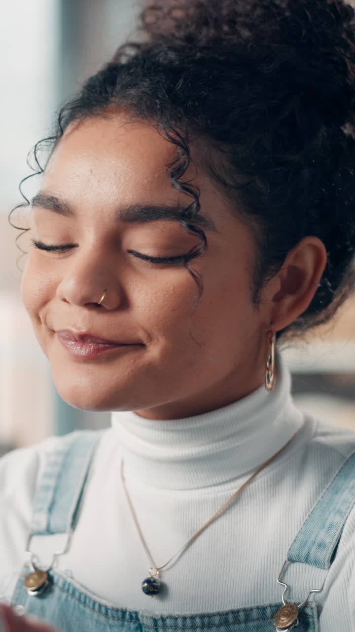 Young Woman Enjoying a Hot Drink with a Content Smile