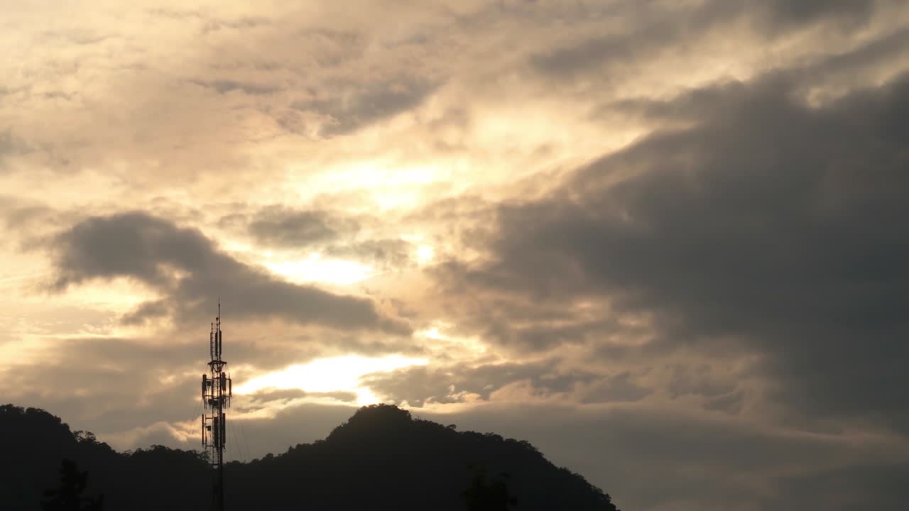 telecommunication tower on dramatic sunset sky n stormy cloud
