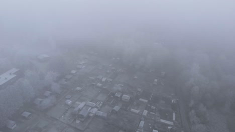 Foggy-Clouds-and-Cold-Winter-Weather-over-Small-Town-of-Gothenburg,-Sweden---Aerial