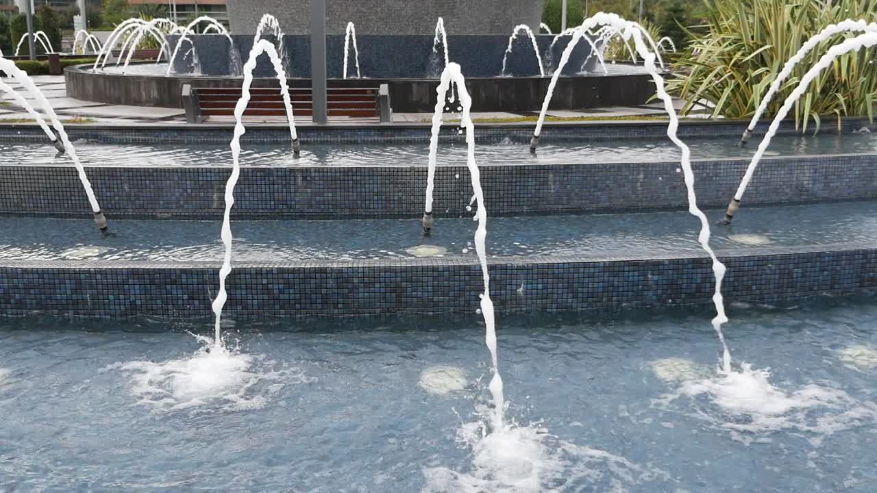 Multi-tiered fountain with water jets