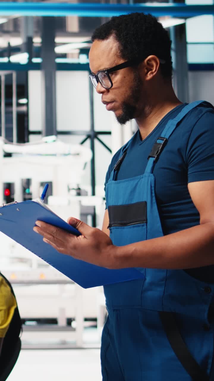 Vertical Video Photovoltaics factory supervisor reviews industrial guidelines of solar plant