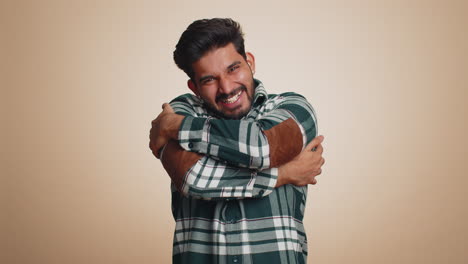 Indian-bearded-man-spread-hands-and-give-hug-embrace-to-you,-pleasant-expression-love-happy-feelings