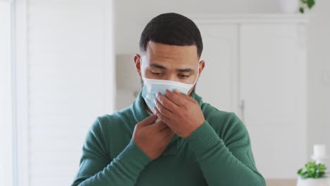 man wearing face mask at home