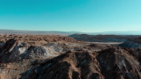 aerial panning shot of mountains in the desert of atacama, chile, south america