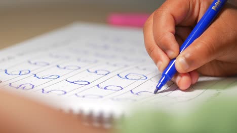 child practicing handwriting