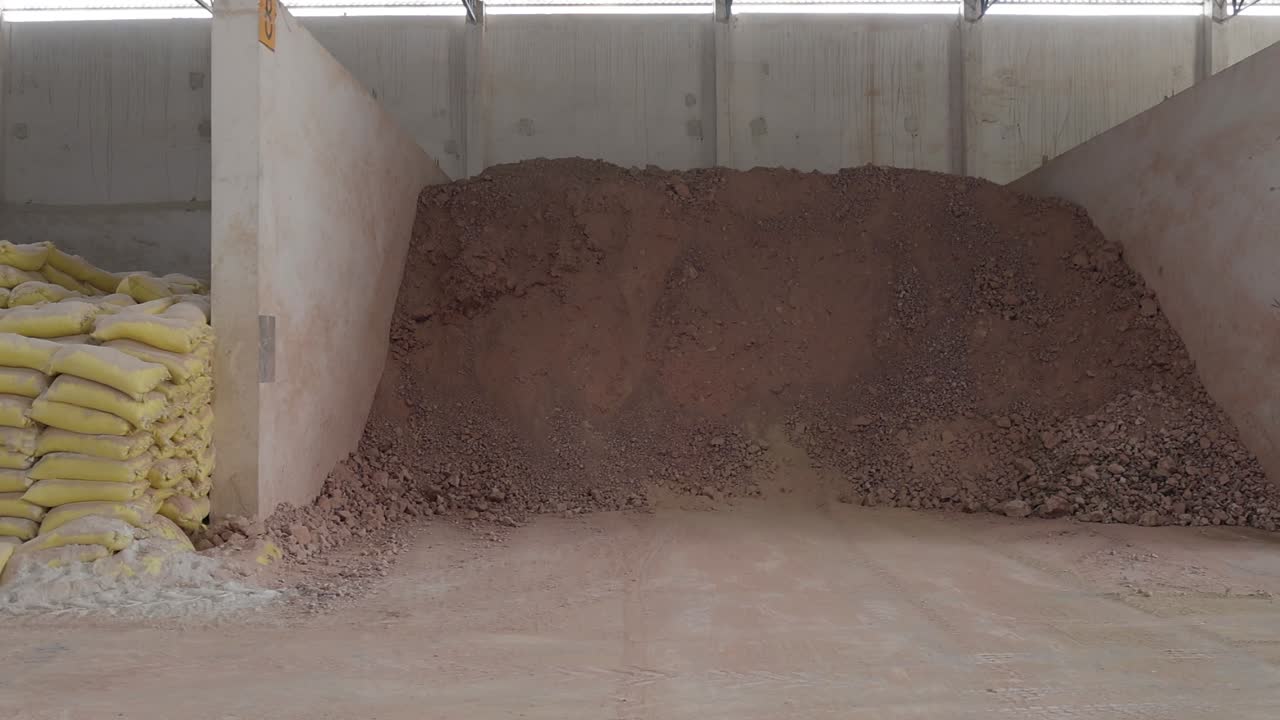 Cement Bags and Clay Storage in a Factory Warehouse