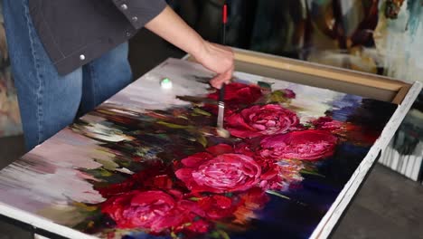 artist painting a colorful peony still life