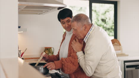 Senior-couple,-hug-and-cooking-at-home-with-love