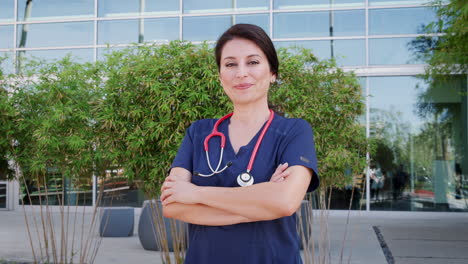 hispanic female doctor wearing scrubs