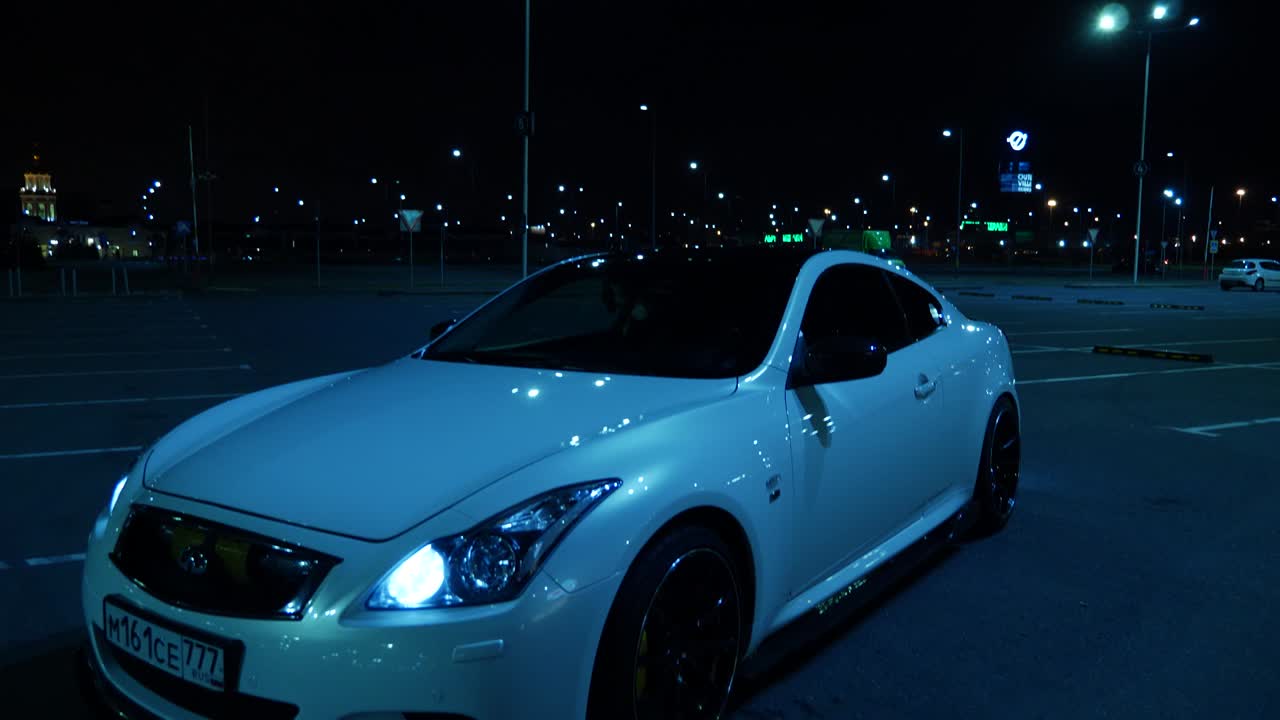 Car in parking lot at night