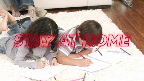 animation of colourful neon words stay at home over caucasian siblings drawing