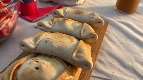 fiestas patrias chile grill parrilla meat chorizo table empanadas chimichurri