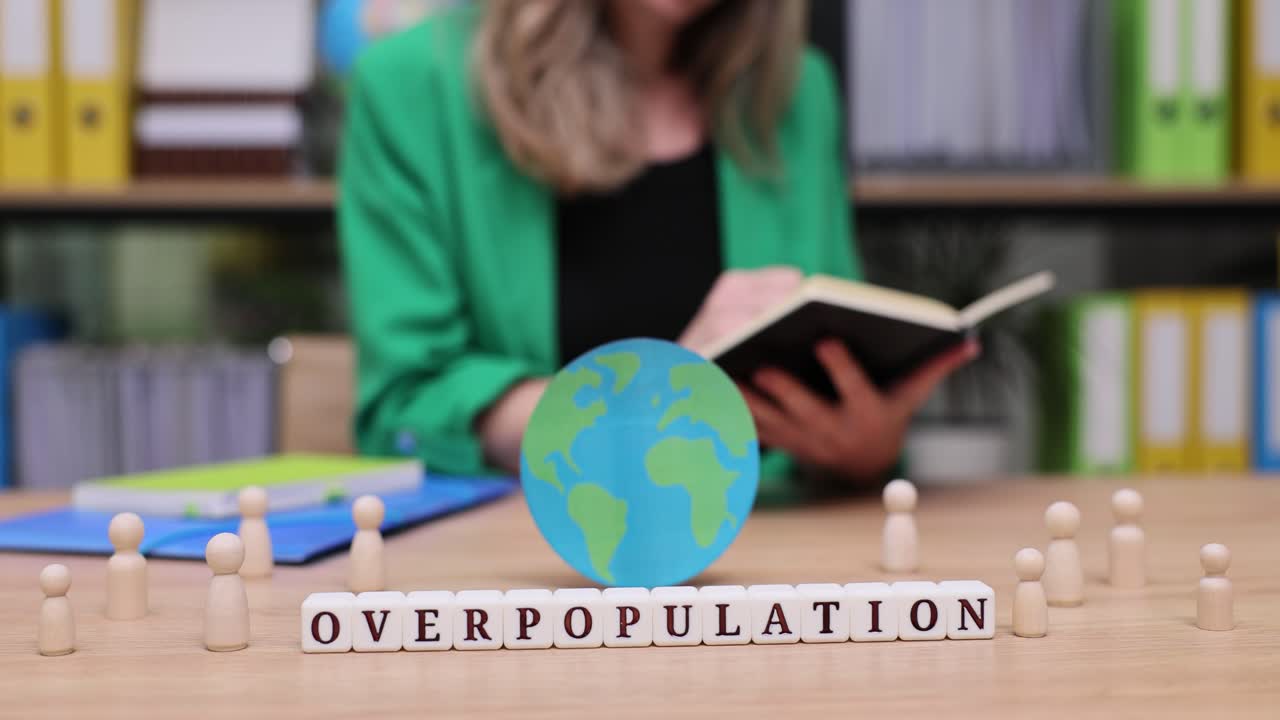 Overpopulation Concept with Globe and Wooden Figures