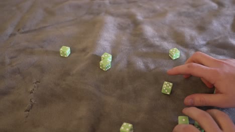 rolling ten lime green dice in slow motion