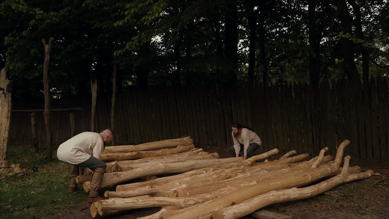 Medieval Men Moving Logs